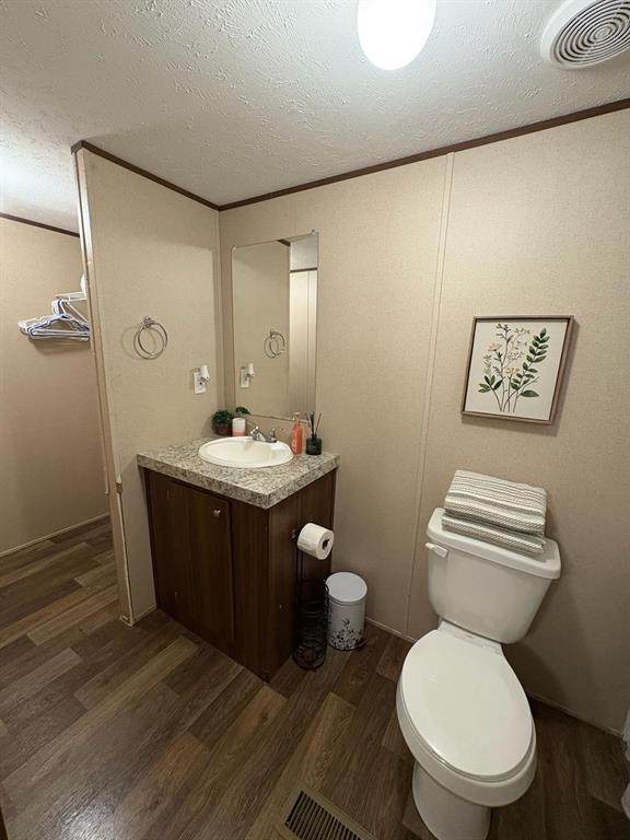 11093 Alta Vista Road Fort Worth, TX 76244 - Photo 6 of 10 a bathroom with a granite countertop toilet sink and mirror