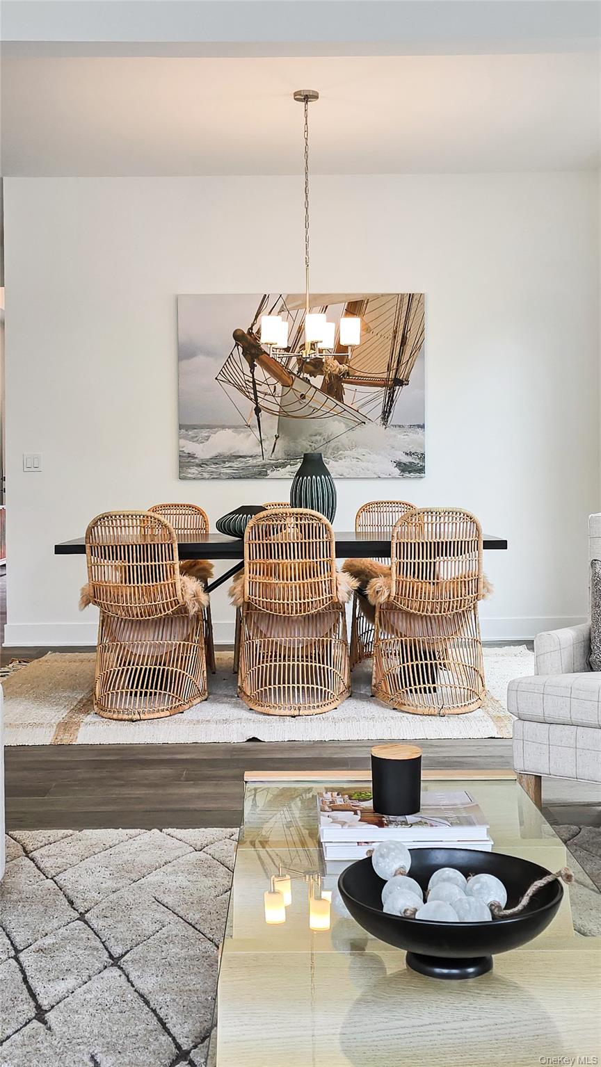 2069 Summit Loop, Unit 98 Carmel, NY 10512 - Photo 11 of 21 a living room with furniture and a chandelier