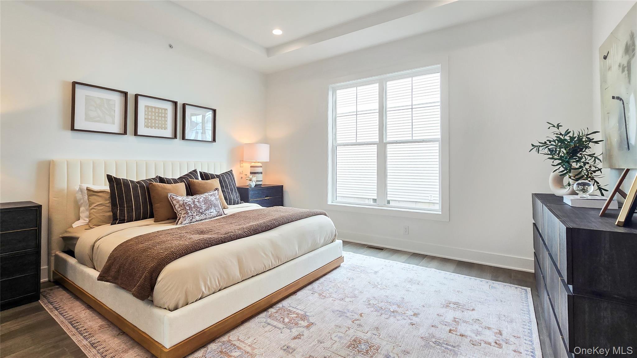 2069 Summit Loop, Unit 98 Carmel, NY 10512 - Photo 13 of 21 a bed room with a bed and a potted plant