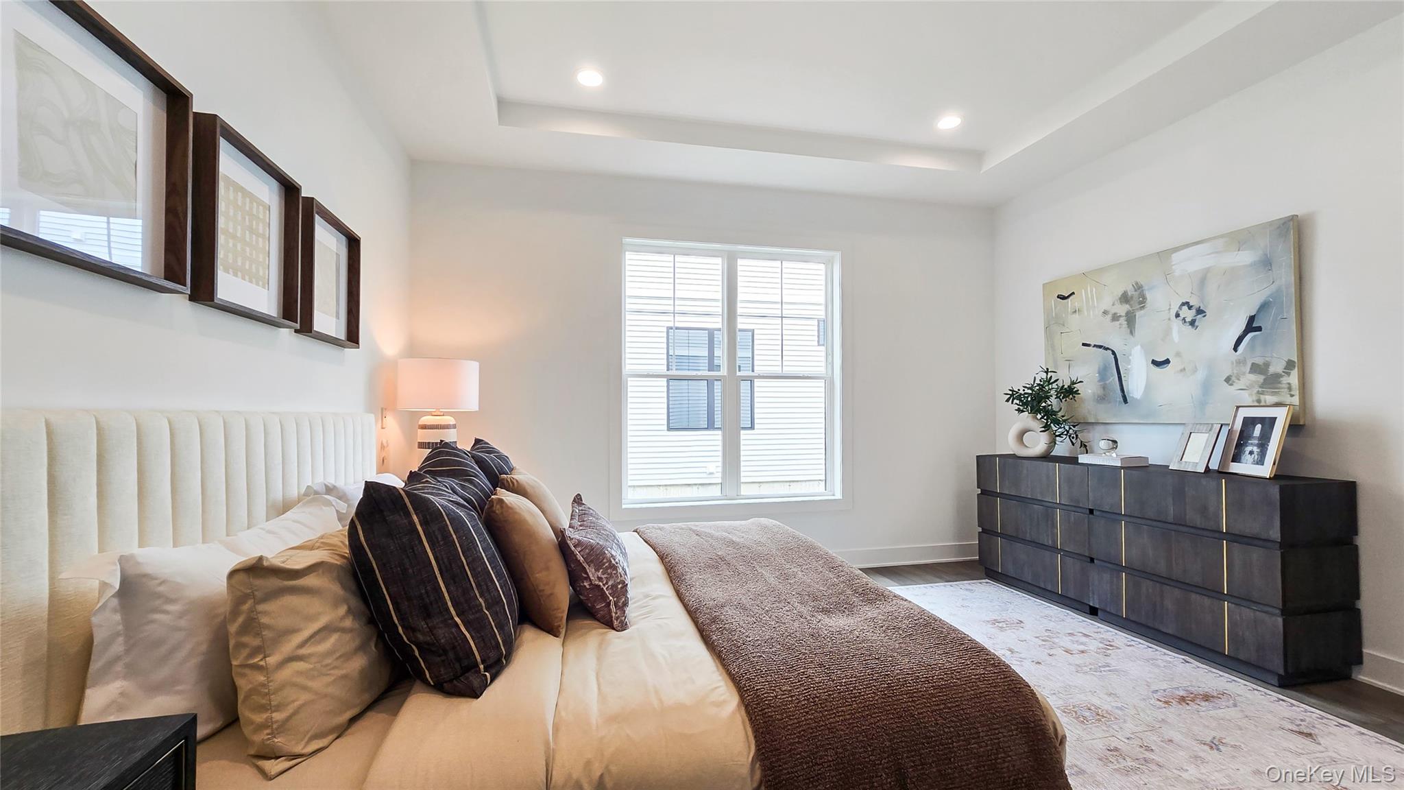 2069 Summit Loop, Unit 98 Carmel, NY 10512 - Photo 16 of 21 a bedroom with a bed and furniture