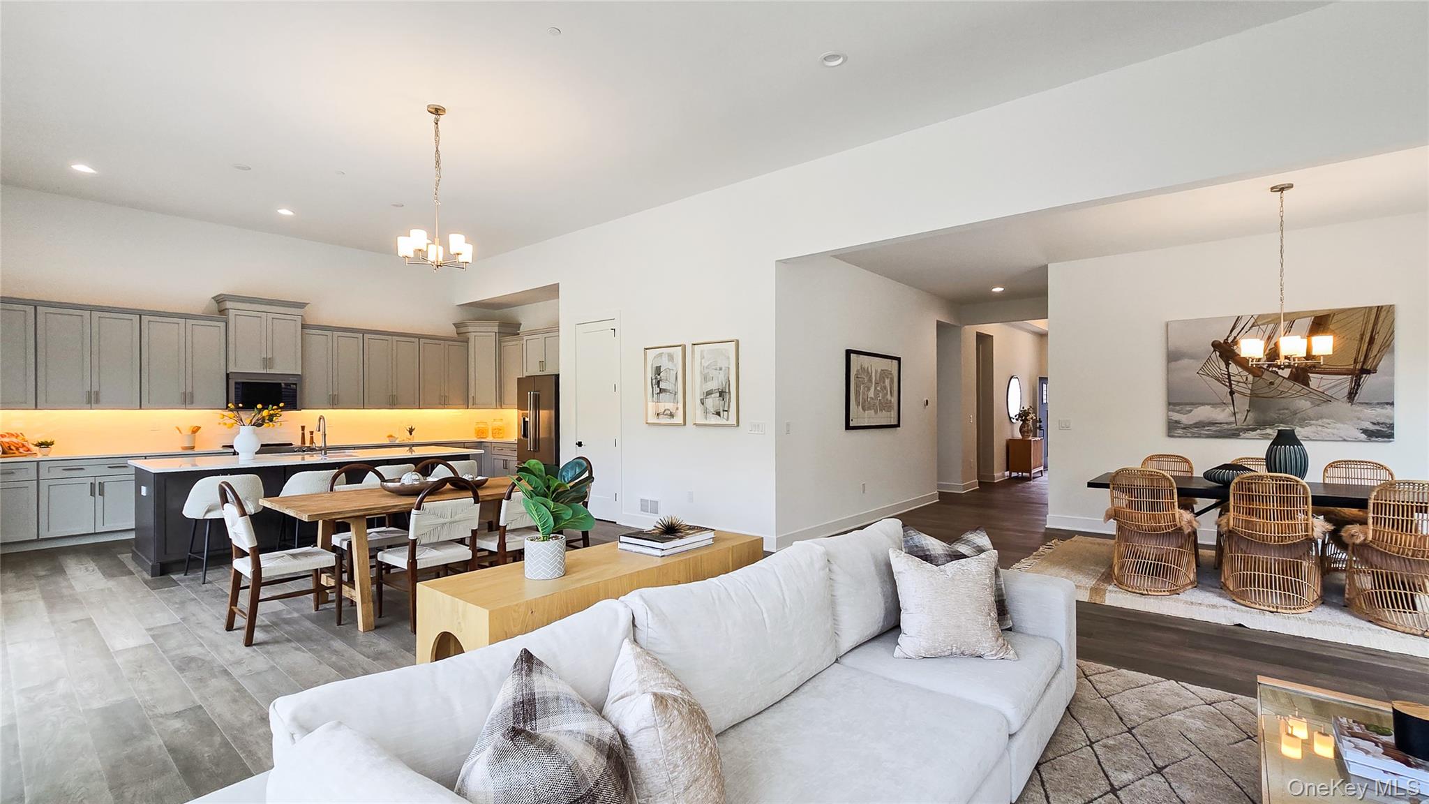 2069 Summit Loop, Unit 98 Carmel, NY 10512 - Photo 4 of 21 a living room with furniture and a chandelier
