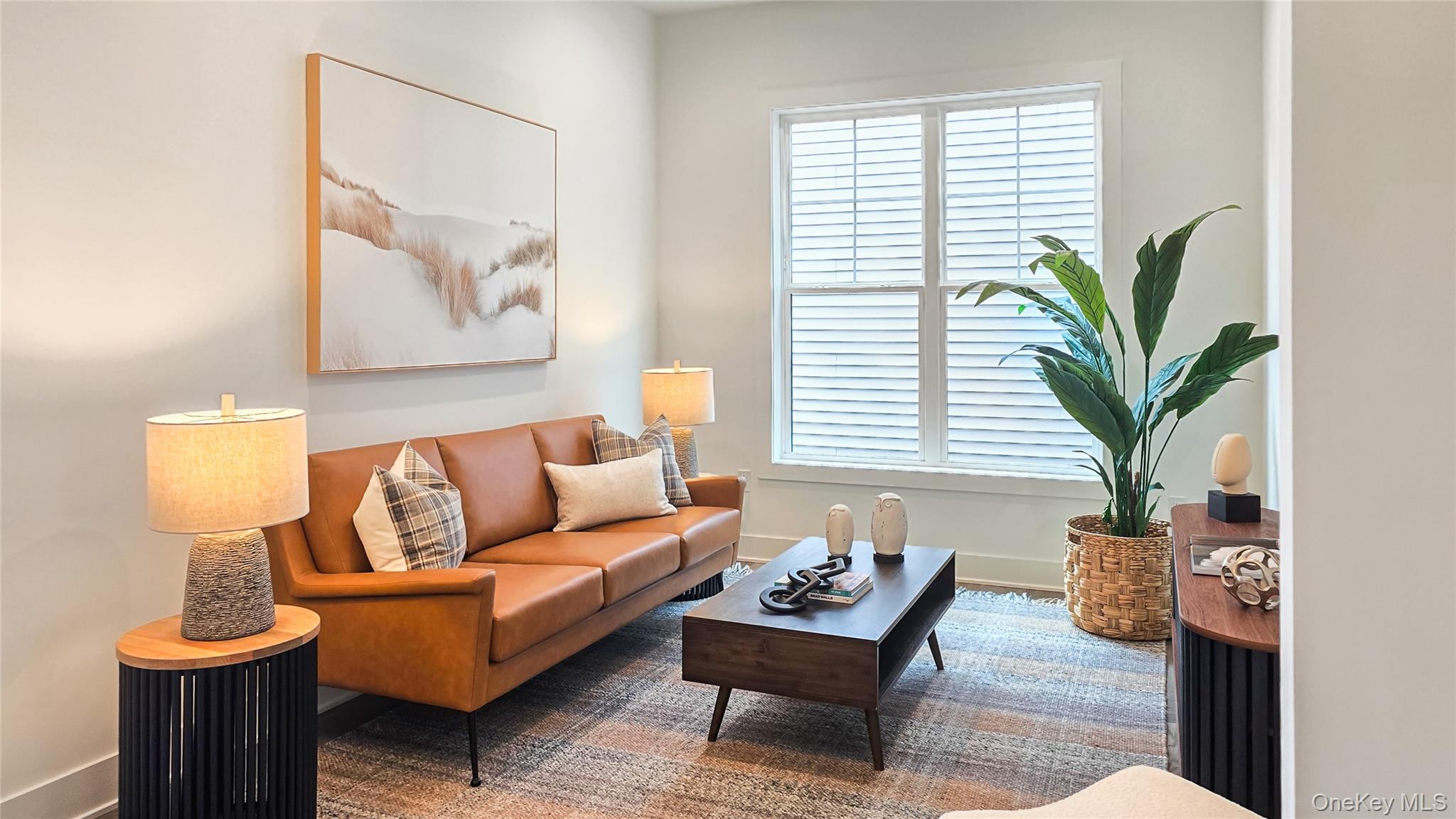 2069 Summit Loop, Unit 98 Carmel, NY 10512 - Photo 7 of 21 a living room with furniture and a potted plant