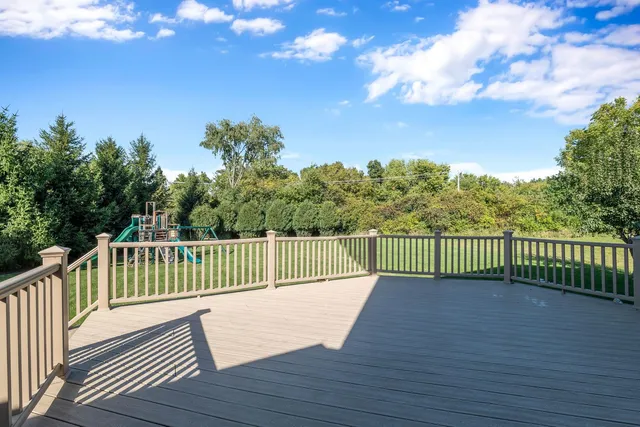 a view of a balcony with wooden fence