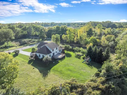 a view of a lake with a yard