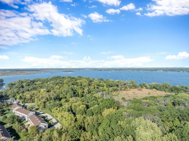 a view of a field with an ocean