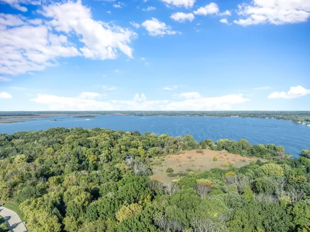 a view of a field with an ocean