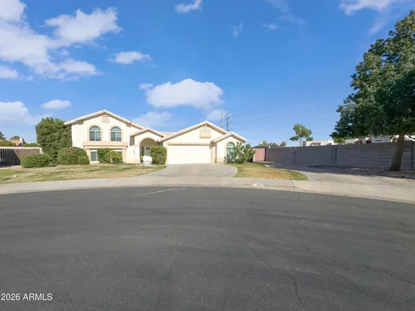 a view of house with yard and street view