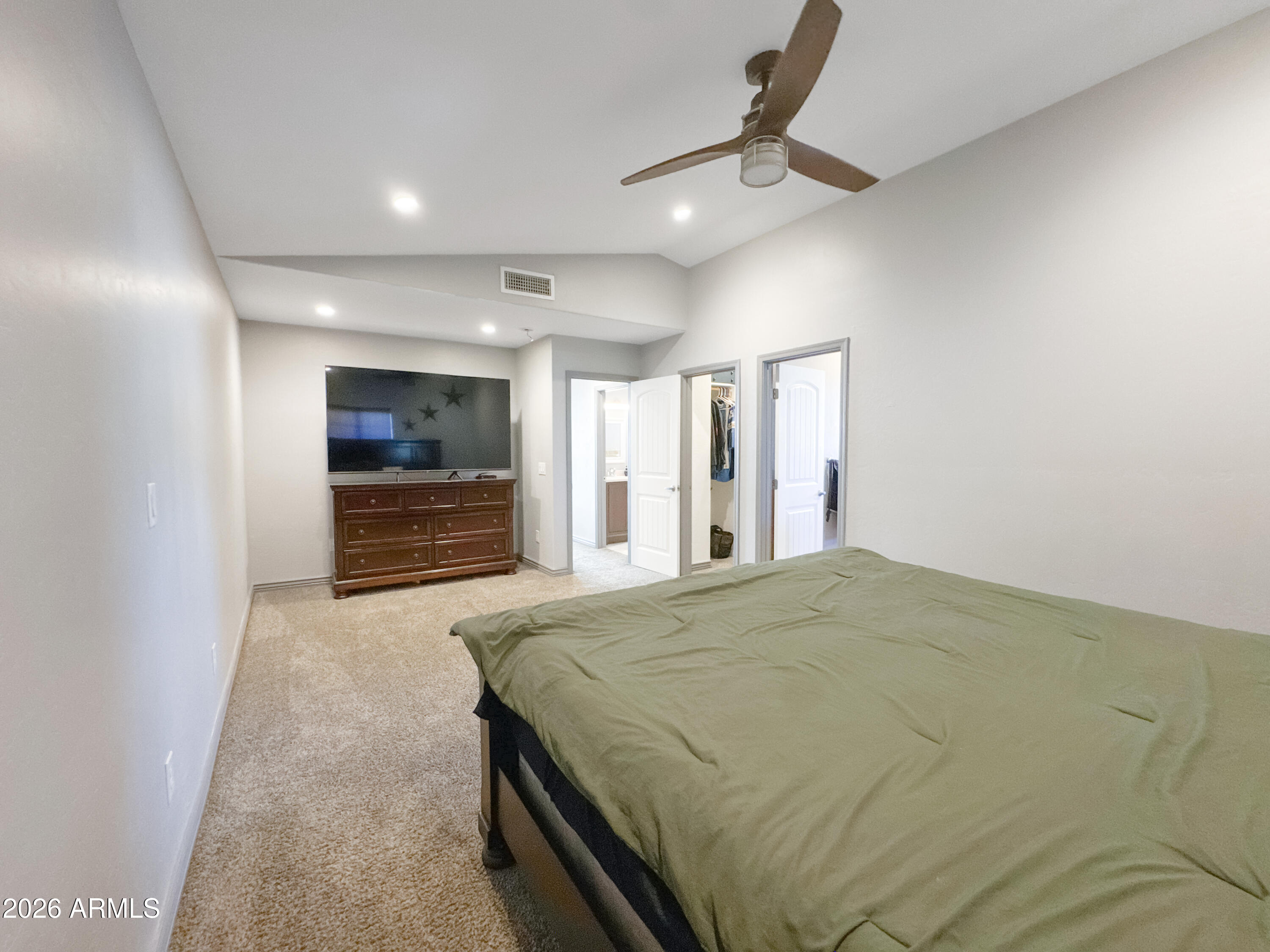 603 North Almar Circle Mesa, AZ 85213 - Photo 13 of 31 a spacious bedroom with a bed and a ceiling fan