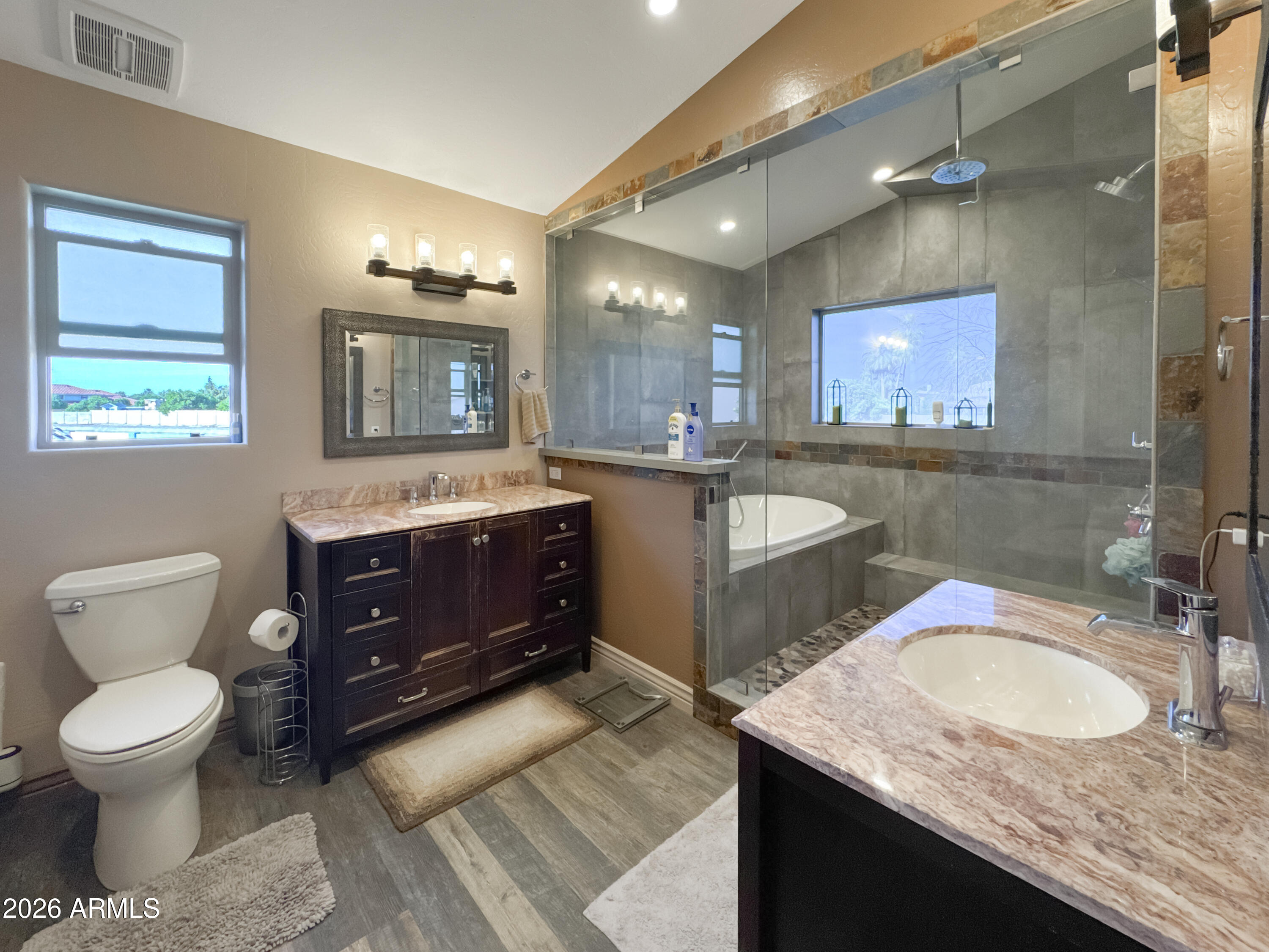 603 North Almar Circle Mesa, AZ 85213 - Photo 14 of 31 a bathroom with a granite countertop sink toilet and a mirror