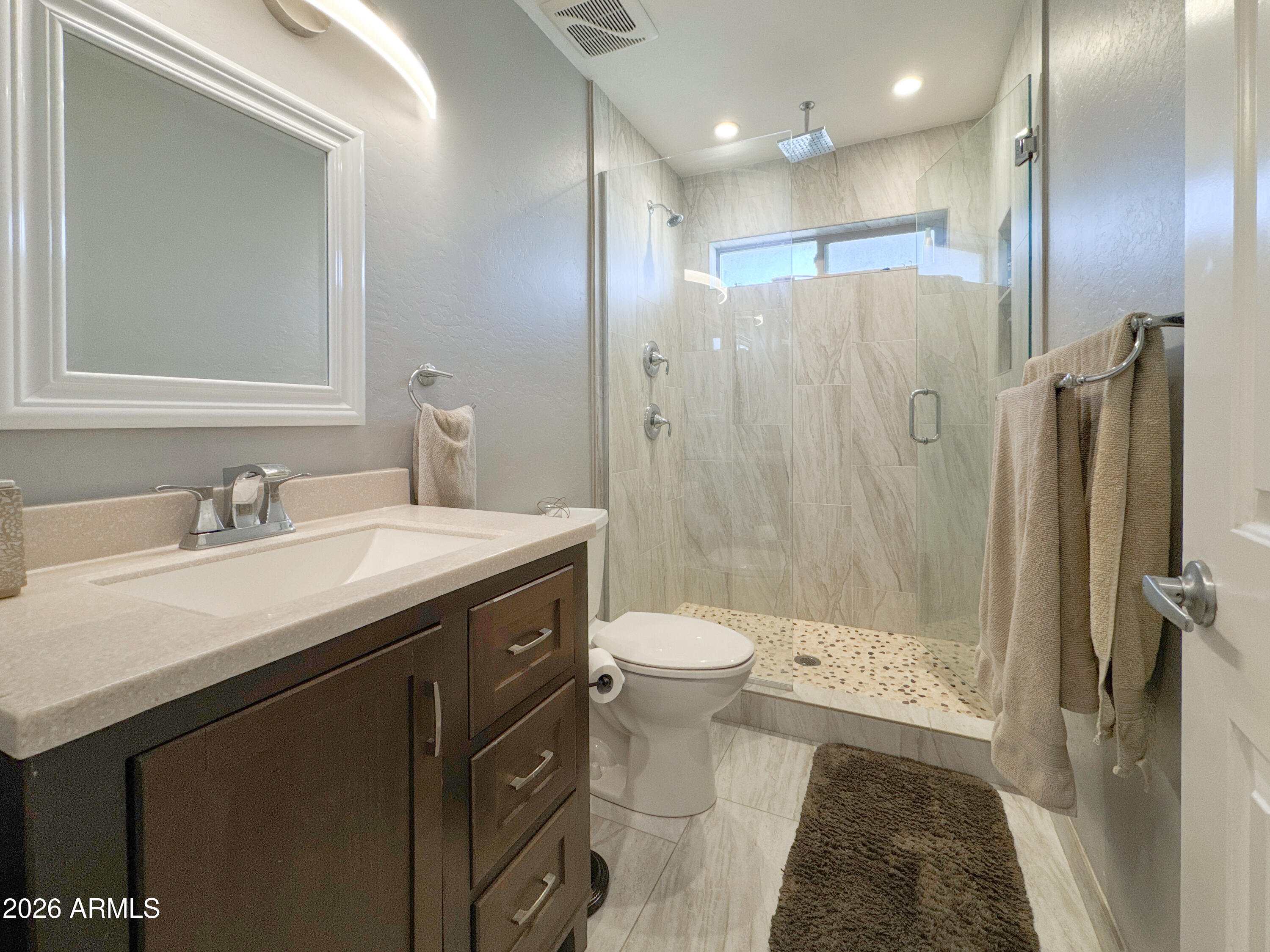 603 North Almar Circle Mesa, AZ 85213 - Photo 19 of 31 a bathroom with a granite countertop sink toilet and shower