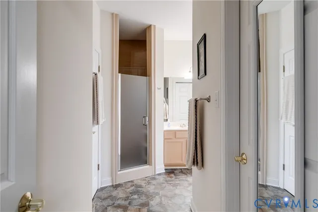 a view of bathroom with a shower and a sink