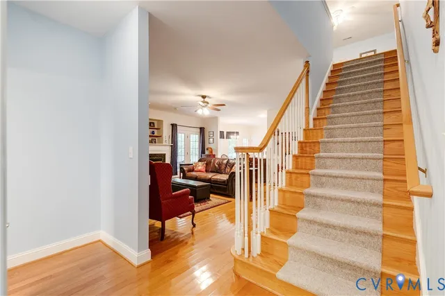 a view of entryway and hall with wooden floor