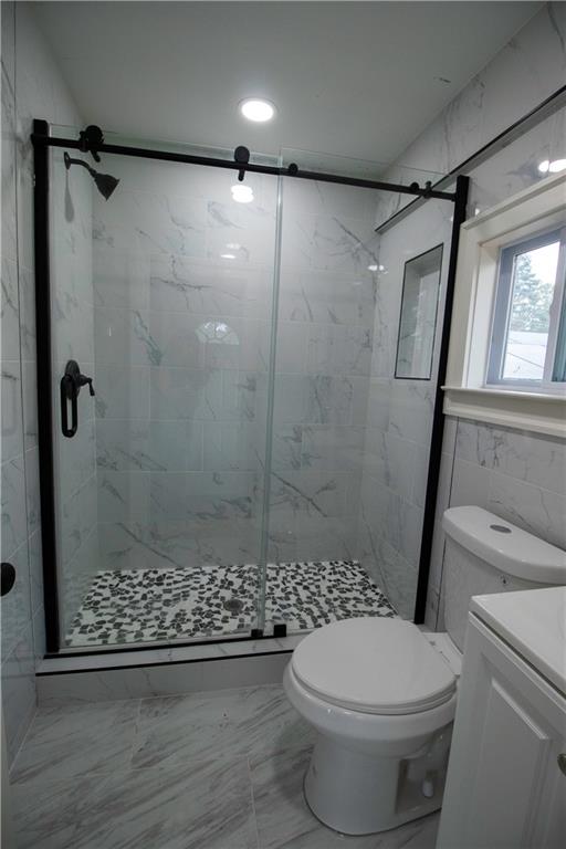 1292 Monfort Road Lawrenceville, GA 30046 - Photo 24 of 48 a bathroom with a shower a toilet and a window