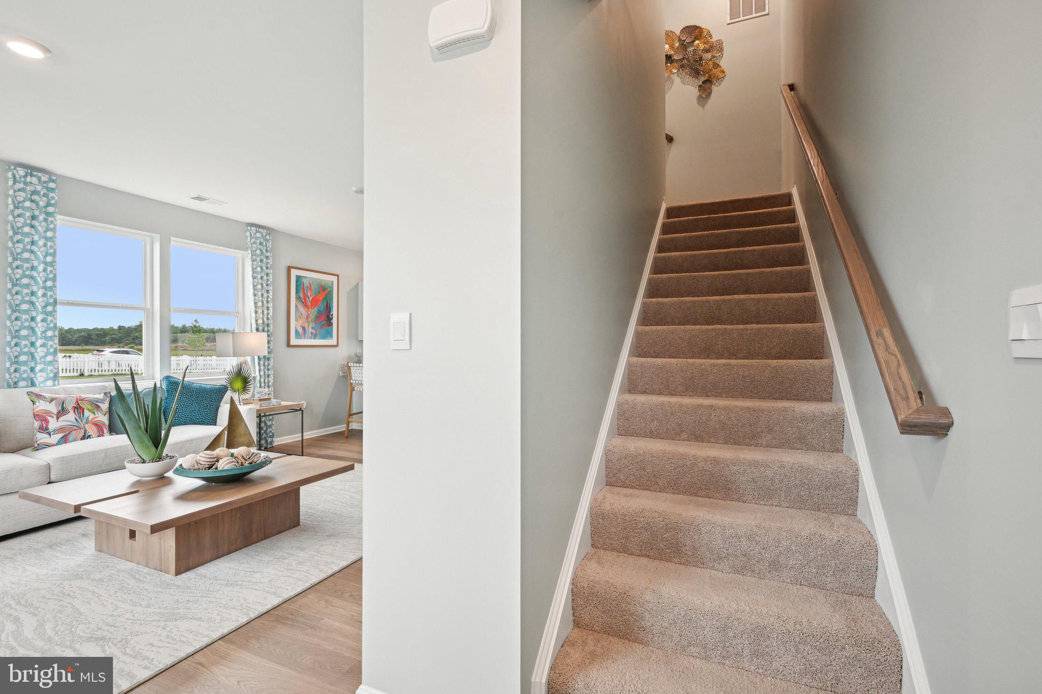 513 Colette Street Ellendale, DE 19941 - Photo 28 of 30 a living room with furniture and stairs