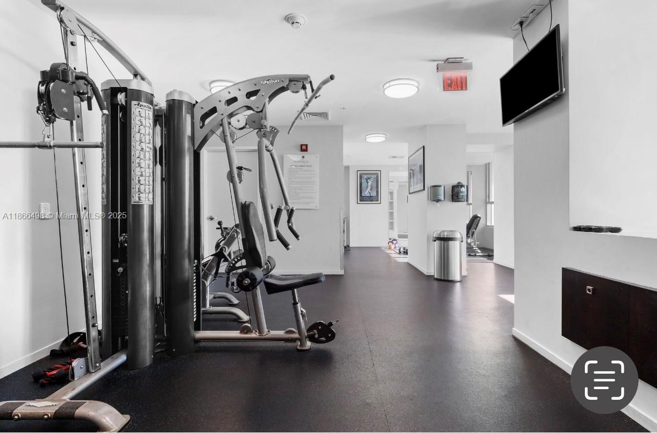 9055 Southwest 73rd Court, Unit 207 Miami, FL 33156 - Photo 12 of 22 a view of a room with gym equipment