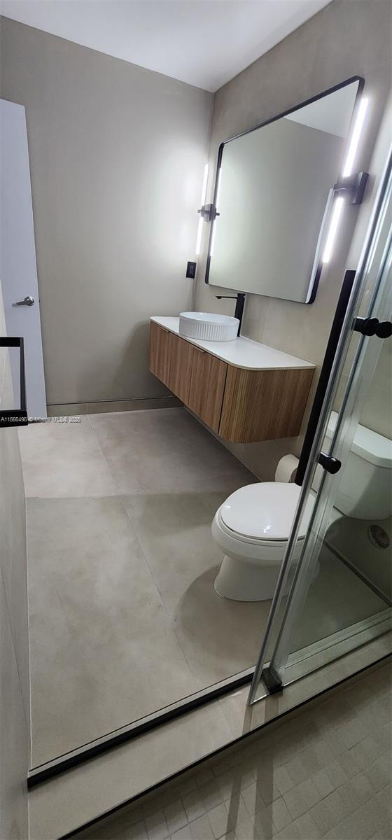 9055 Southwest 73rd Court, Unit 207 Miami, FL 33156 - Photo 8 of 22 a room with a chair