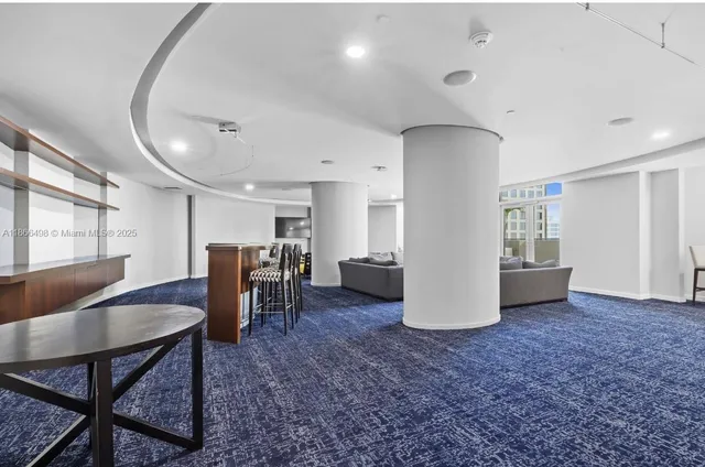 a view of work space with furniture and window