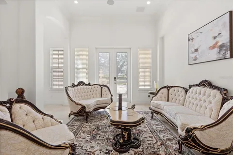a bedroom with a bed and a potted plant
