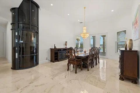 a living room with furniture a table and a fireplace