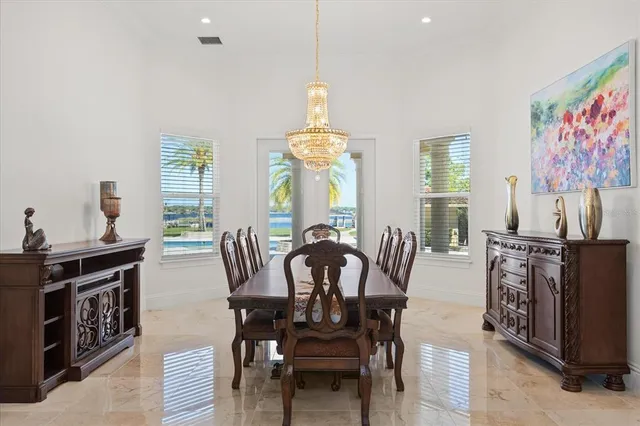 a view of a dining room with furniture window and outside view
