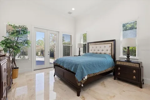a living room with lots of furniture and a chandelier