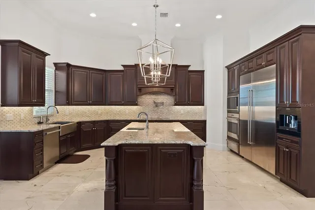 a view of a hallway with wooden floor and windows