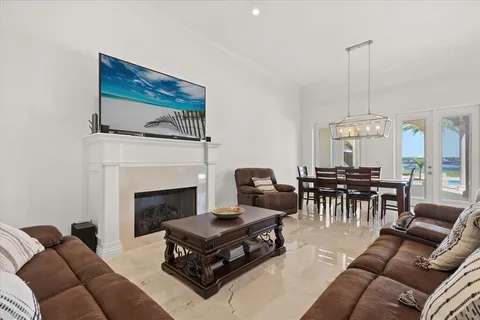 a large bed sitting in a bedroom next to a window