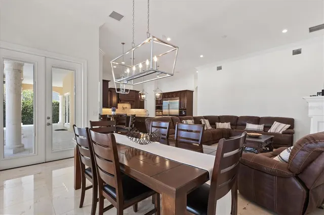 a bedroom with furniture and a large window