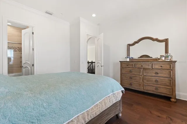 a living room with furniture and a dining table with kitchen view