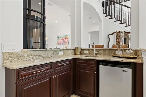 a kitchen with stainless steel appliances granite countertop a sink a stove and dishwasher
