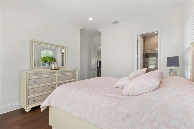 a bathroom with a double vanity sink mirror and shower