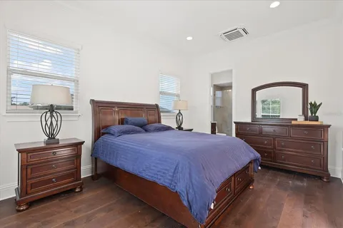 a view of a house with swimming pool next to a yard