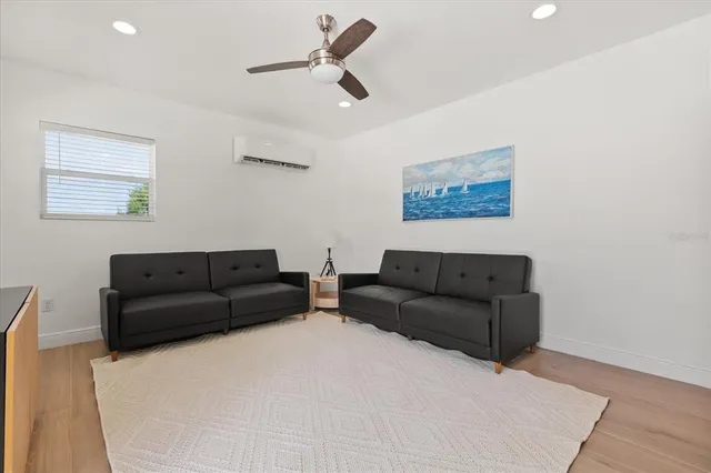 an aerial view of a house with a yard basket ball court and outdoor seating