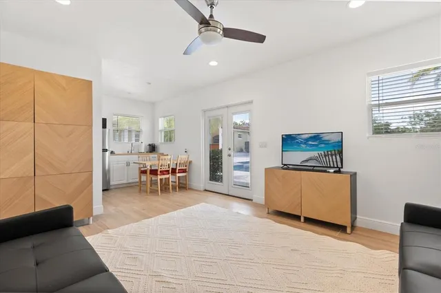 a view of a swimming pool with a table and chairs
