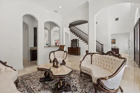 a spacious bedroom with a bed and a potted plant