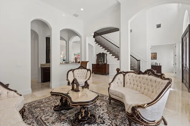 a spacious bedroom with a bed and a potted plant