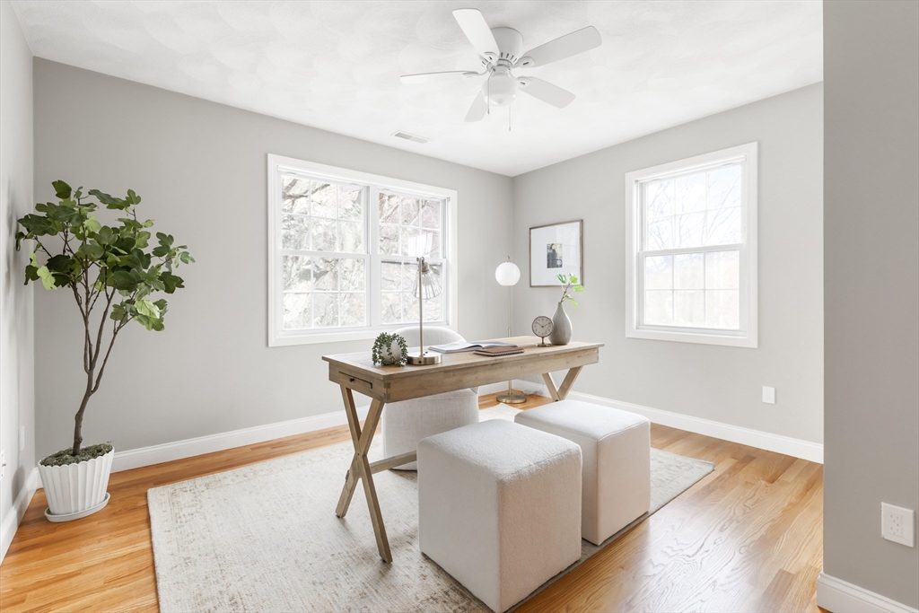70 Sylvan Street, Unit 70 Melrose, MA 02176 - Photo 13 of 20 a living room with furniture and a potted plant