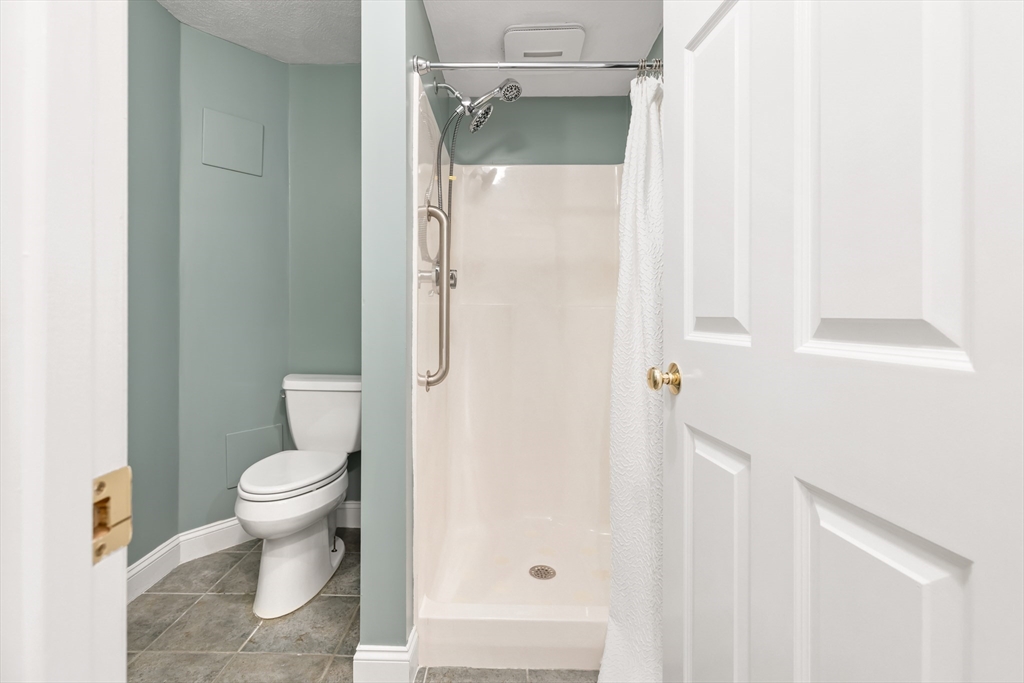 70 Sylvan Street, Unit 70 Melrose, MA 02176 - Photo 19 of 20 a white toilet sitting next to a bathroom