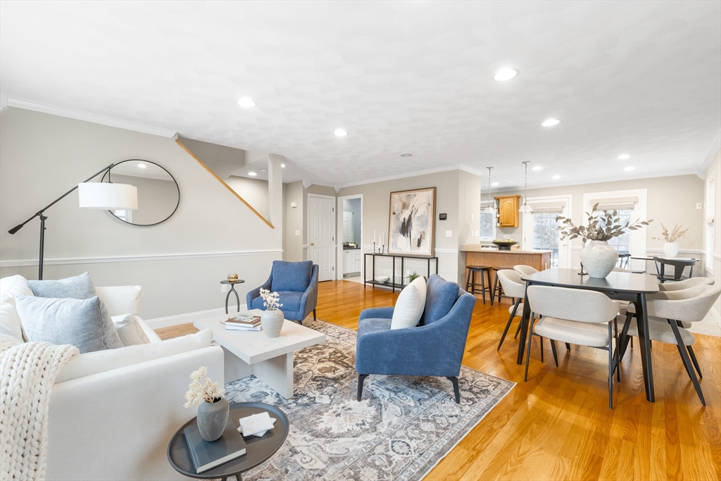70 Sylvan Street, Unit 70 Melrose, MA 02176 - Photo 3 of 20 a living room with furniture a rug and a large window