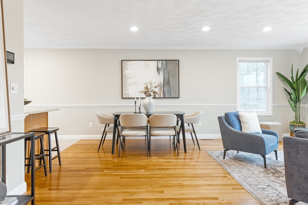 70 Sylvan Street, Unit 70 Melrose, MA 02176 - Photo 4 of 20 a view of a dining room with furniture and wooden floor