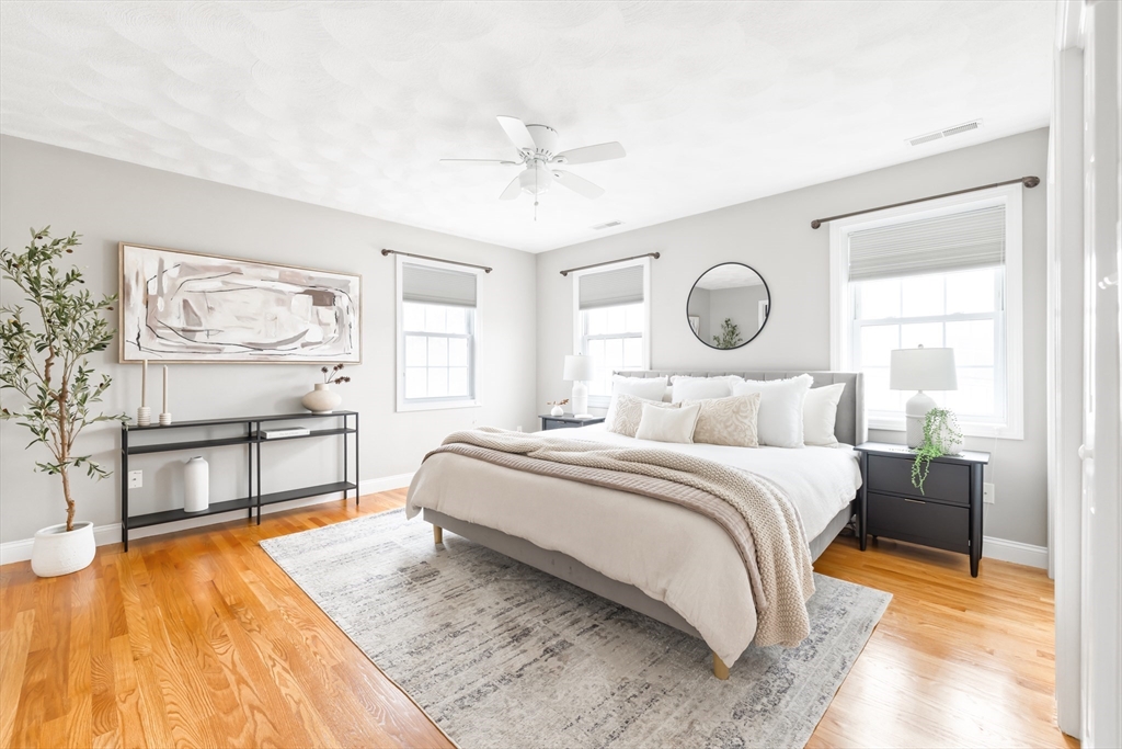 70 Sylvan Street, Unit 70 Melrose, MA 02176 - Photo 9 of 20 a bed room with a bed mirror and a window
