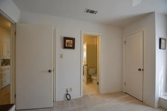 a bedroom with a bed and a cabinets