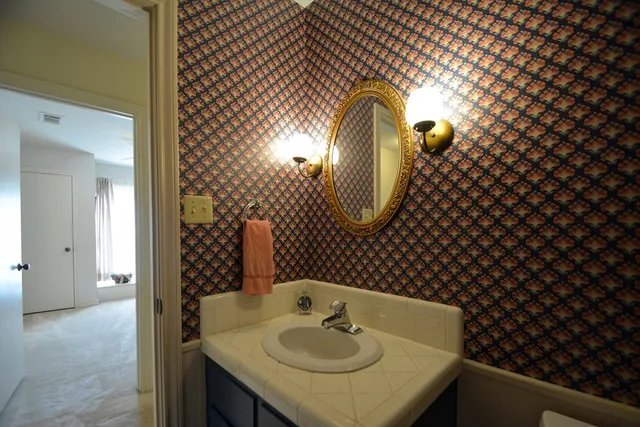 a view of a dining area with furniture and floor to ceiling window