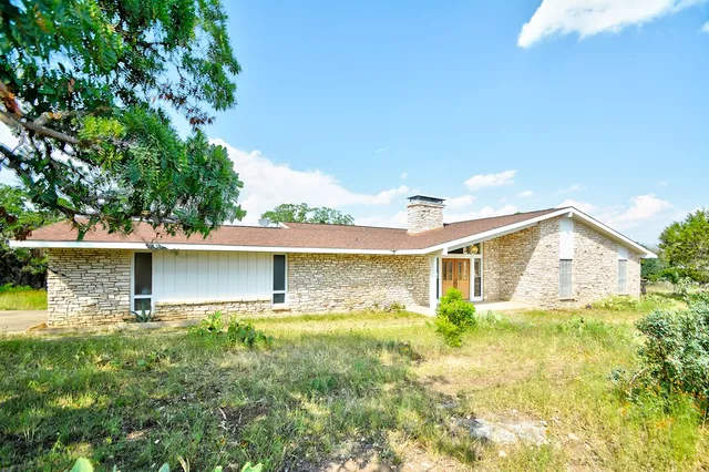 a view of a street with a tree