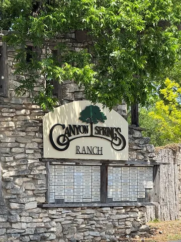 a sign that is sitting on a wooden wall