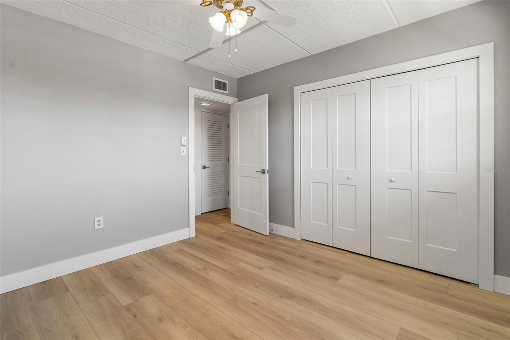 1 Boca Ciega Point Boulevard, Unit 113 St. Petersburg, FL 33708 - Photo 12 of 36 a view of an empty room with wooden floor