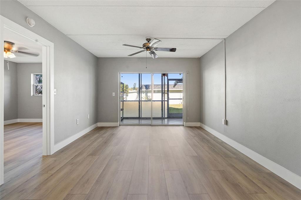 1 Boca Ciega Point Boulevard, Unit 113 St. Petersburg, FL 33708 - Photo 18 of 36 wooden floor in an empty room with a window