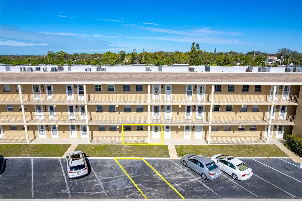 1 Boca Ciega Point Boulevard, Unit 113 St. Petersburg, FL 33708 - Photo 27 of 36 a view of a swimming pool with a lounge chair