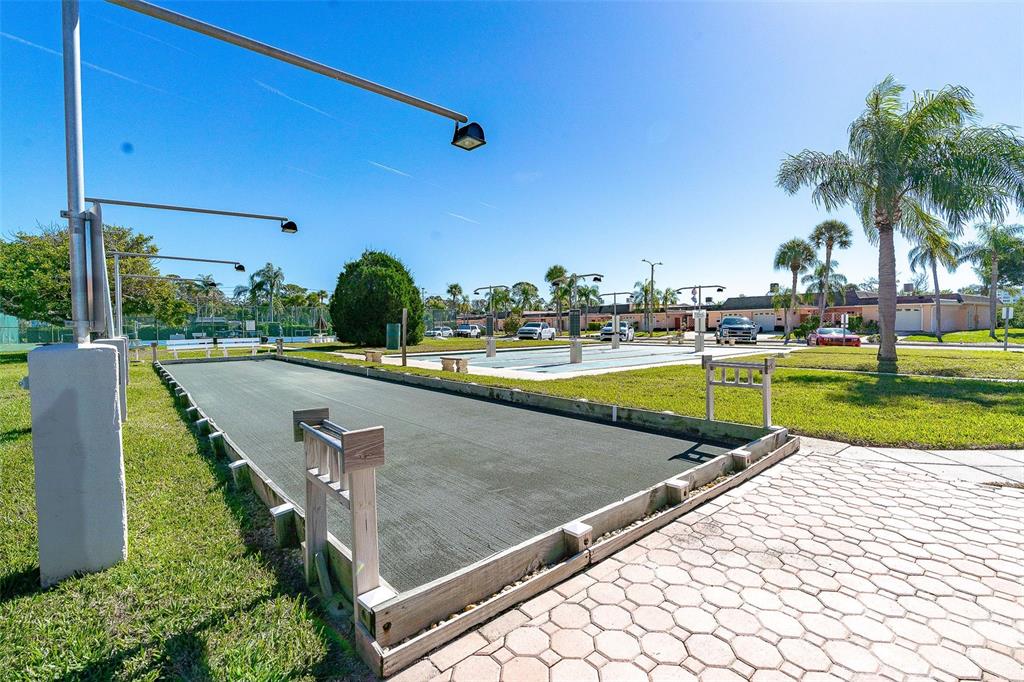 1 Boca Ciega Point Boulevard, Unit 113 St. Petersburg, FL 33708 - Photo 33 of 36 a view of a park with swings and slides