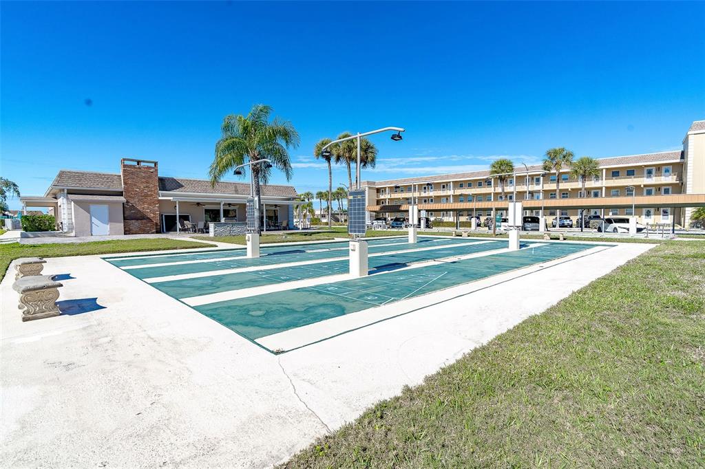 1 Boca Ciega Point Boulevard, Unit 113 St. Petersburg, FL 33708 - Photo 35 of 36 a view of a building with a swimming pool